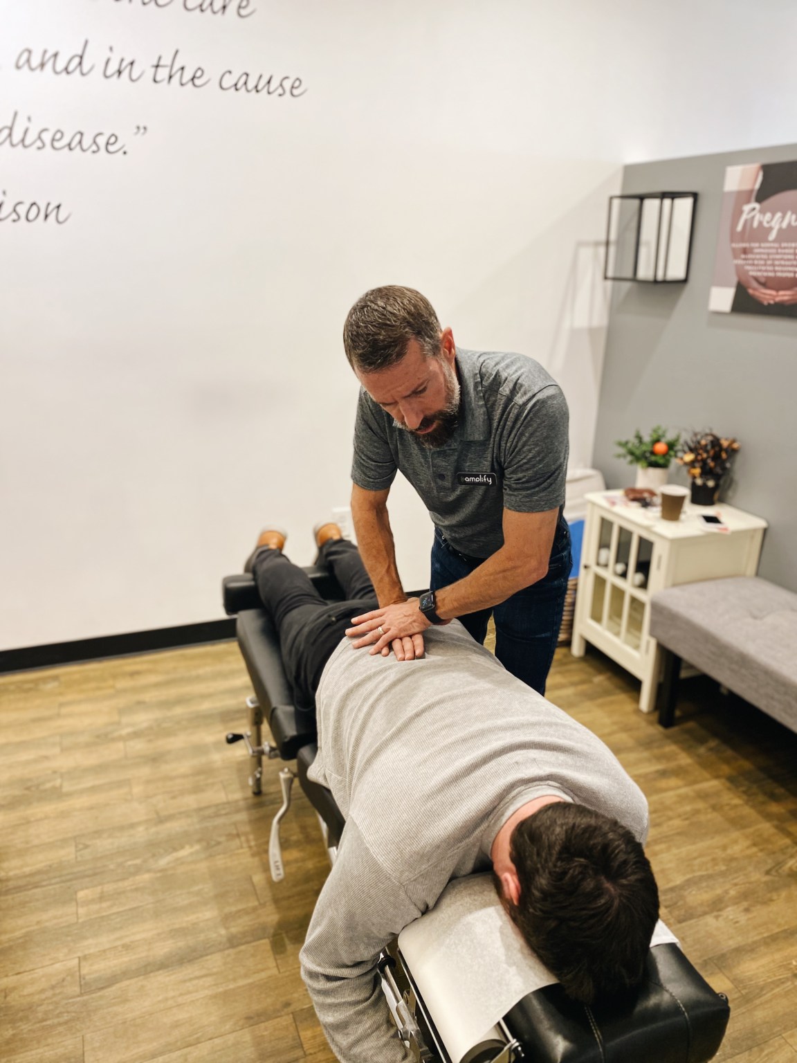 Dr. Schulz performing a drop-table adjustment on a patient lying face down
