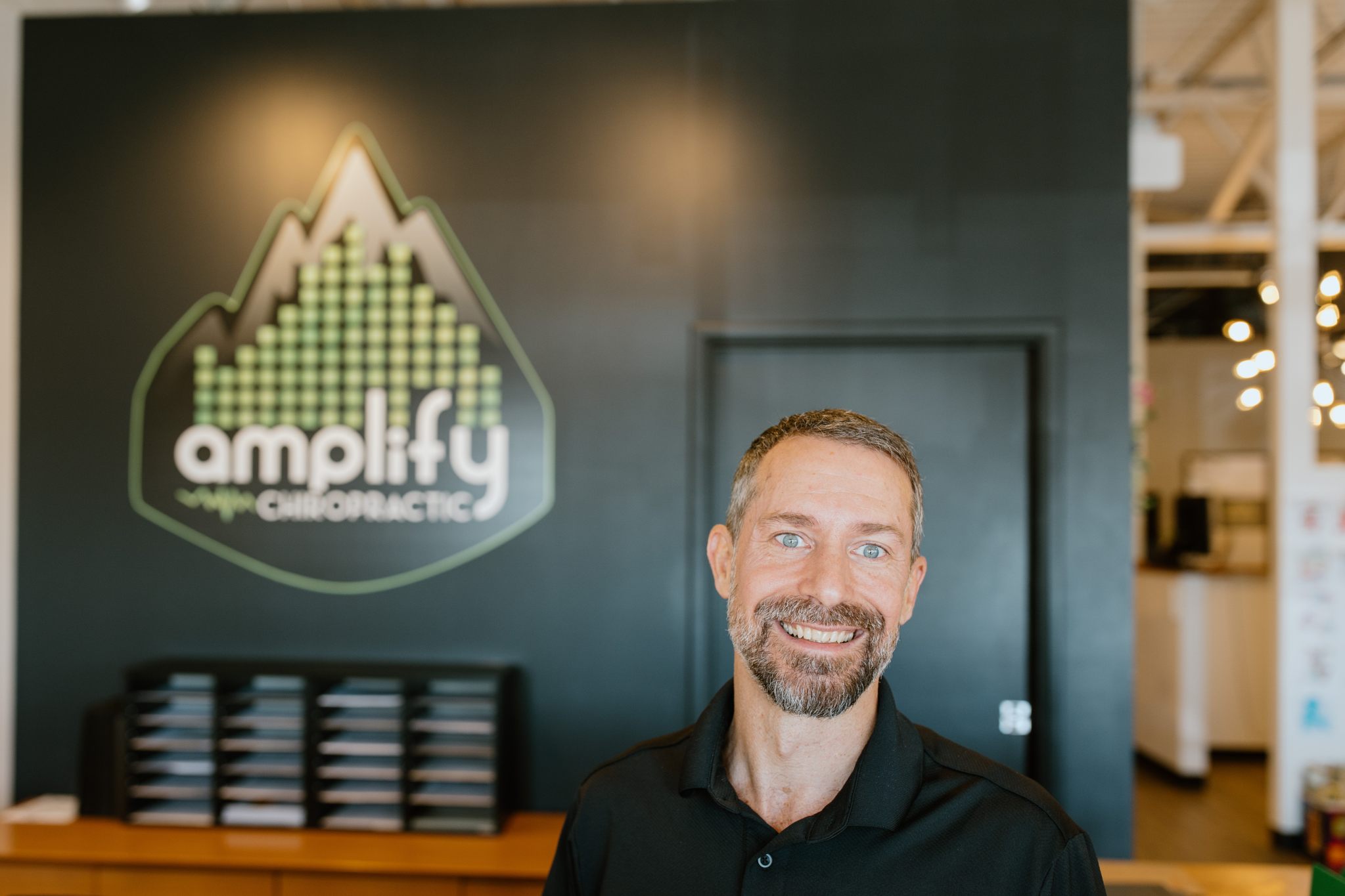 Dr. Brian Schulz in his Littleton chiropractic office
